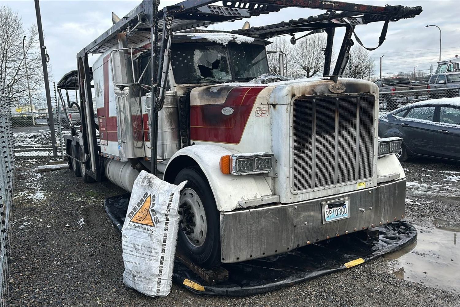 Recovered Semi-Truck in our secure yard with spill containment measures. 